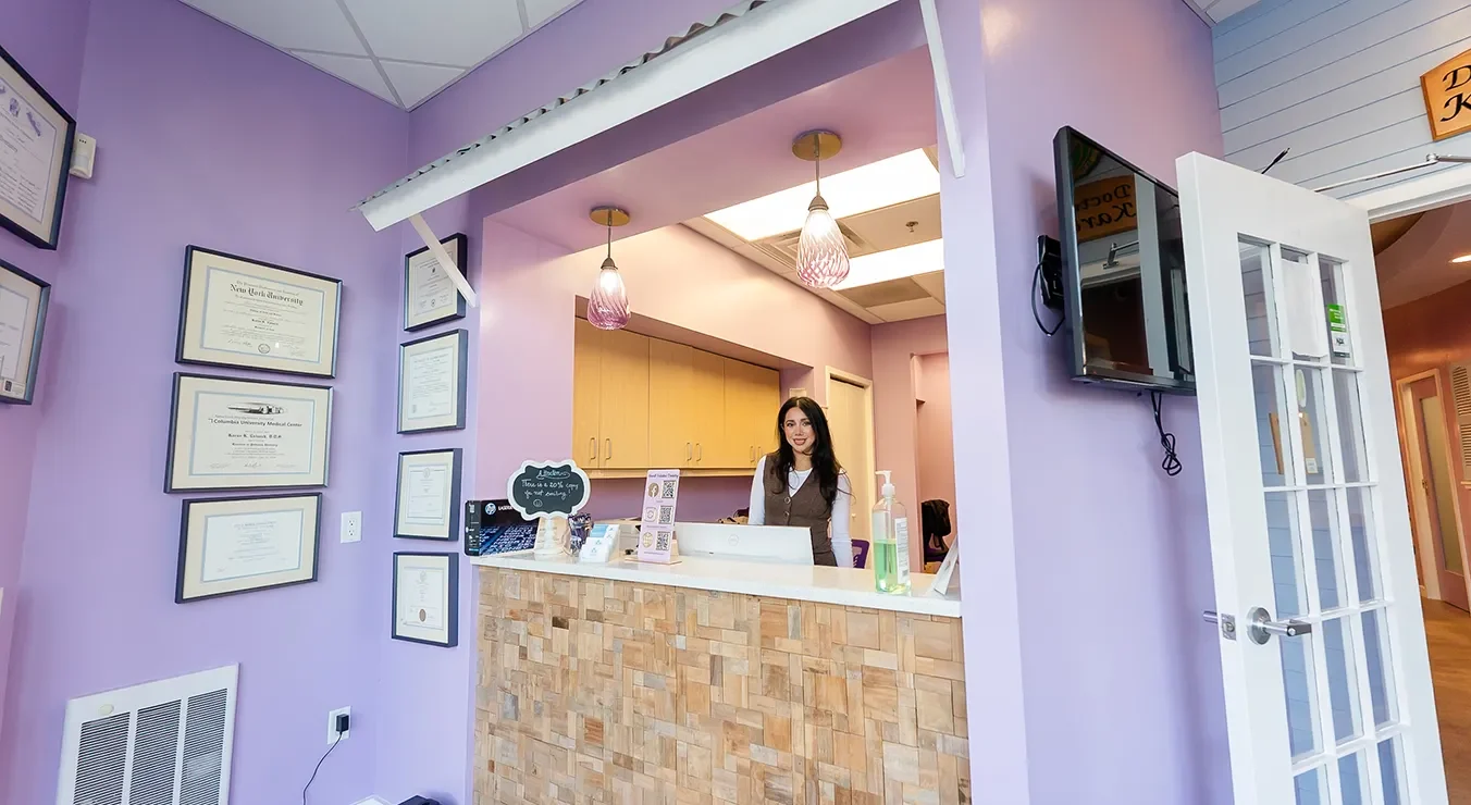 A receptionist at Howell Pediatric Dentistry welcoming new patients in Howell, NJ