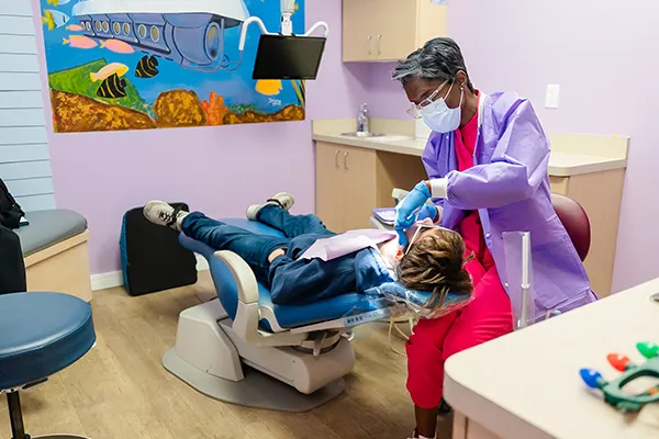 Dr. Karan preparing patient for fillings procedure