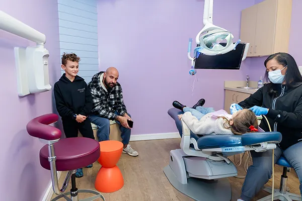 Restorative Dental Treatment for Children – Howell Pediatric Dentistry A patient in dental chair for her restorative treatment